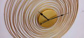 Decorative wall clock with concentric circular design on a white background