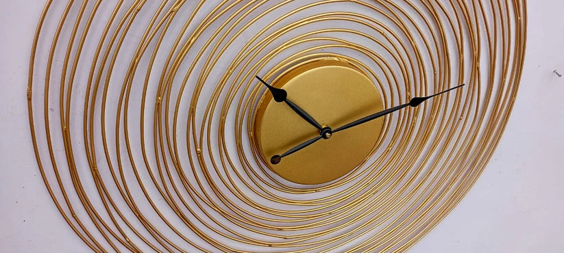 Decorative wall clock with concentric circular design on a white background