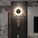 Decorative wall clock with gold accents on a dark wall.