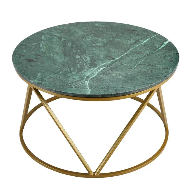 Round center table with green marble top and gold metal base on a white background