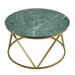 Round center table with green marble top and gold metal base on a white background