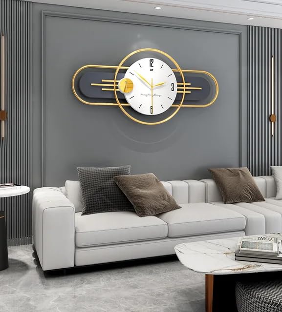 Modern wall clock with gold accents in a living room setting.