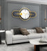 Modern wall clock with gold accents in a living room setting.