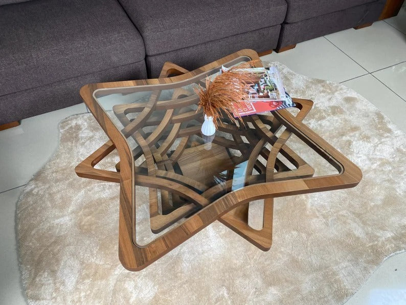 Wooden coffee table with a glass top in a living room setting