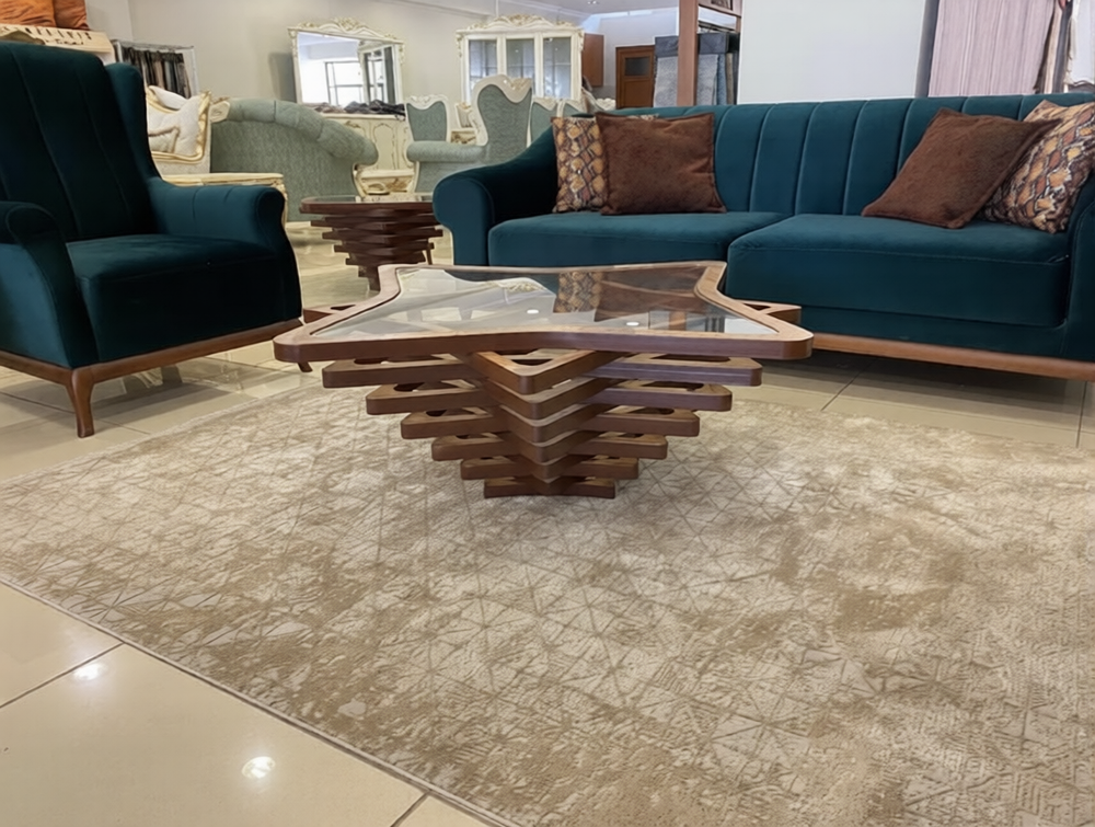 Modern living room with teal sofa, armchair, and wooden coffee table.