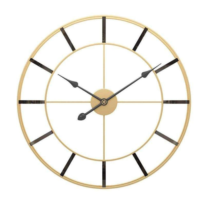 Gold and black wall clock on a white background
