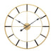 Gold and black wall clock on a white background