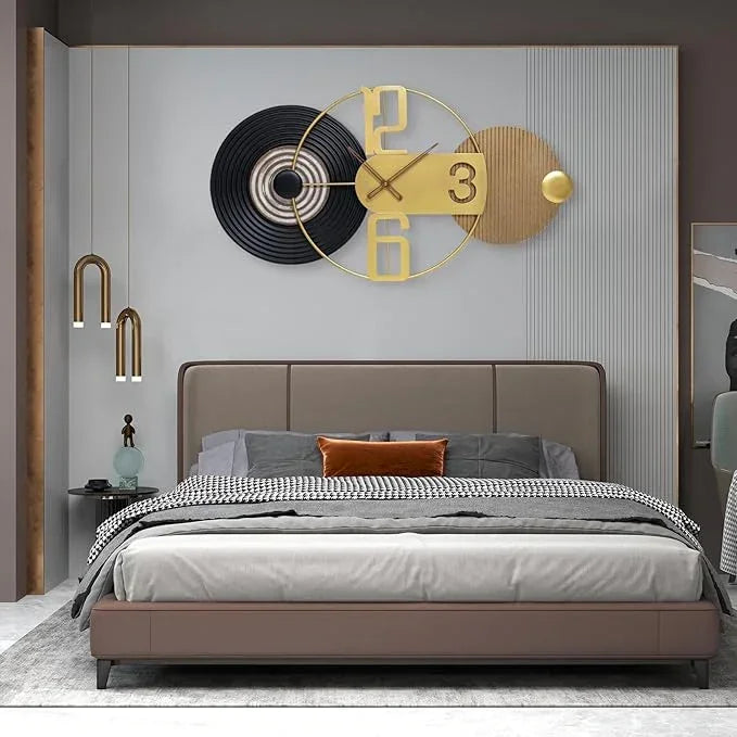 Modern bedroom with a bed, decorative wall clock, and side table.