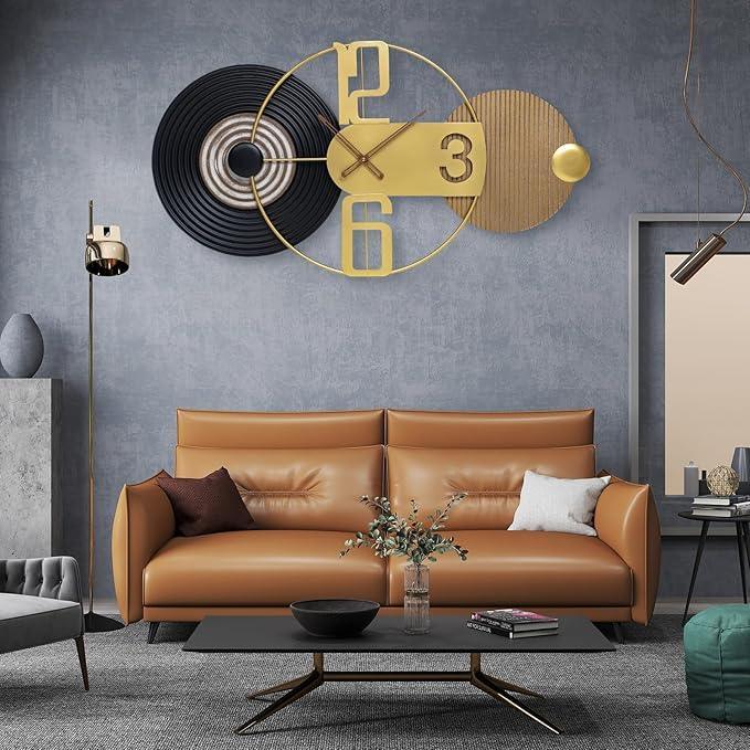Modern living room with a brown leather sofa, decorative clock, and side table.