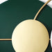 Gold circular object on a green background
