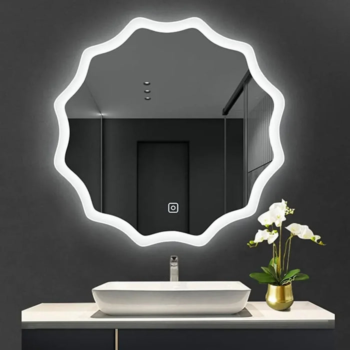 large round led mirror above the basin