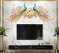 dual peacock design wall clock on a wall