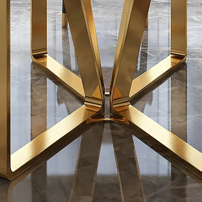 Gold metal chair leg on a reflective surface