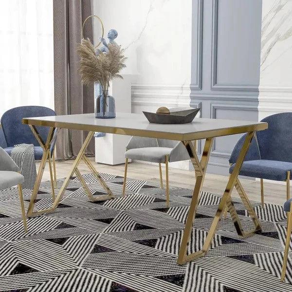 Dining room with a table, chairs, and decorative elements on a patterned rug.