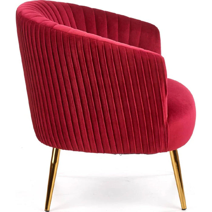 maroon velvet armchair with gold legs on side view