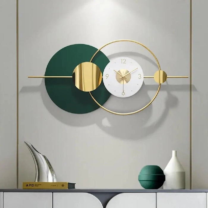 Modern wall clock with green and gold design on a gray wall