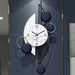 Modern wall clock with decorative elements on a dark background