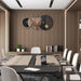 Modern conference room with wooden walls, a large table, chairs, and decorative wall clock.