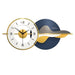 Decorative wall clock with blue and gold design on a white background