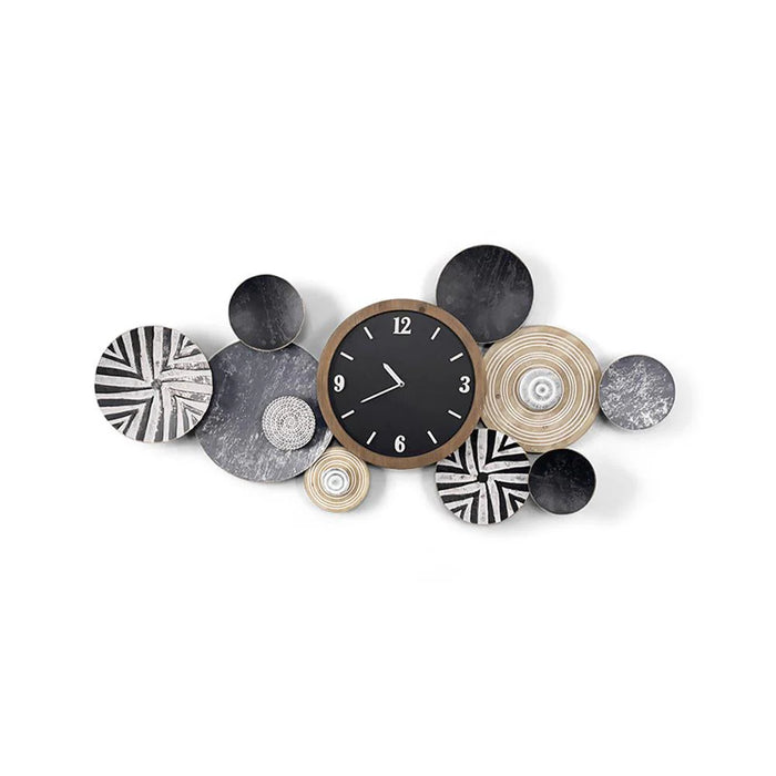 Decorative wall clock with circular, patterned designs on a white background