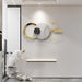 Modern wall clock with gold accents on a white wall
