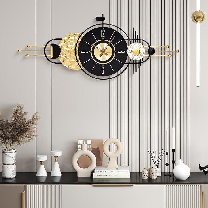 Decorative wall clock with gold accents on a wall with a striped pattern