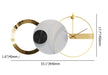 Modern wall clock with gold and white design, showing measurements on a white background.