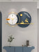 Decorative wall clock with deer design on a gray wall