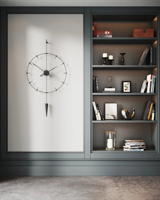 Modern interior with a clock on a white wall and shelves with decorative items.