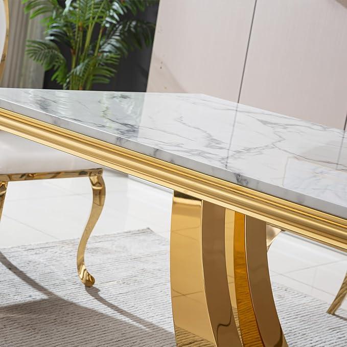 Dining table with marble top and gold legs in a room setting