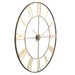 Large antique wall clock with gold Roman numerals on a white background