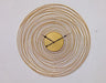Decorative wall clock with gold circular design on a white background