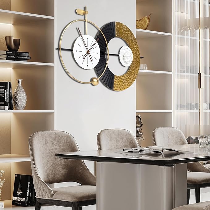 Modern wall clock with gold and black design in a dining room setting