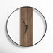 Wooden oversized wall clock with black frame on a white background