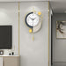 Decorative wall clock with gold accents on a modern interior wall.
