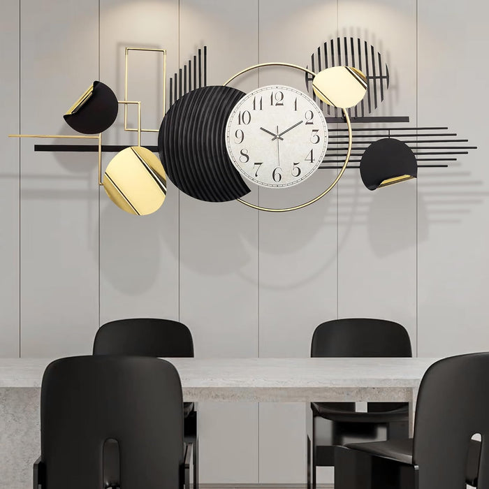 Modern wall clock with geometric design in a room with a table and chairs.