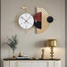 Decorative wall clock with abstract design on a neutral wall