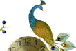 Decorative peacock clock with colorful feathers on a white background