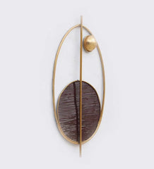 Gold and dark brown wall art on a white background