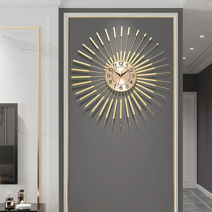 Decorative wall clock with gold accents on a gray wall