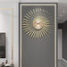Decorative wall clock with gold accents on a gray wall