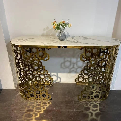 Decorative console table with marble top and gold geometric base.