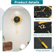 Wall clock with sleek metal hands, easy-to-read numerals, and unique pendulum on a white background.
