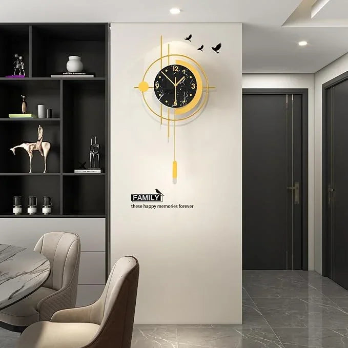 Modern wall clock with decorative design on a white wall in a room with furniture.