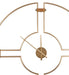 Gold wall clock with geometric design on a white background