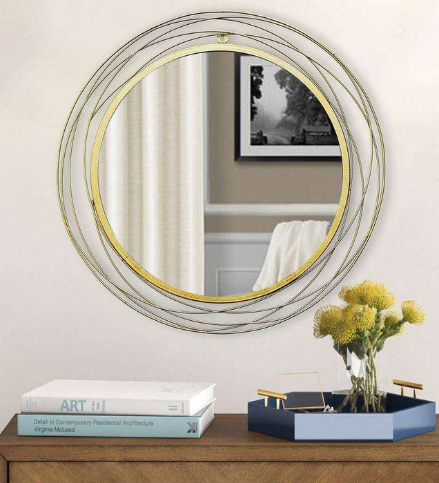 Round wall mirror in golden colour