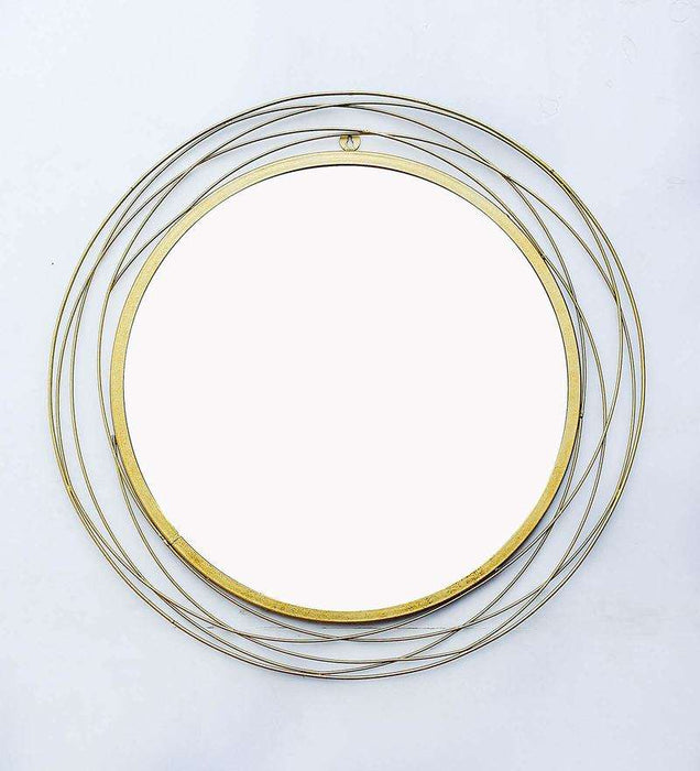 Round wall mirror in golden colour