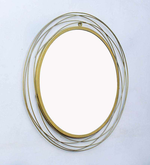 Round wall mirror in golden colour