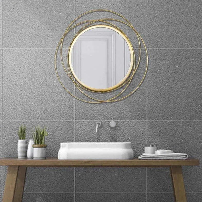 Round wall mirror in golden colour - All India Decor